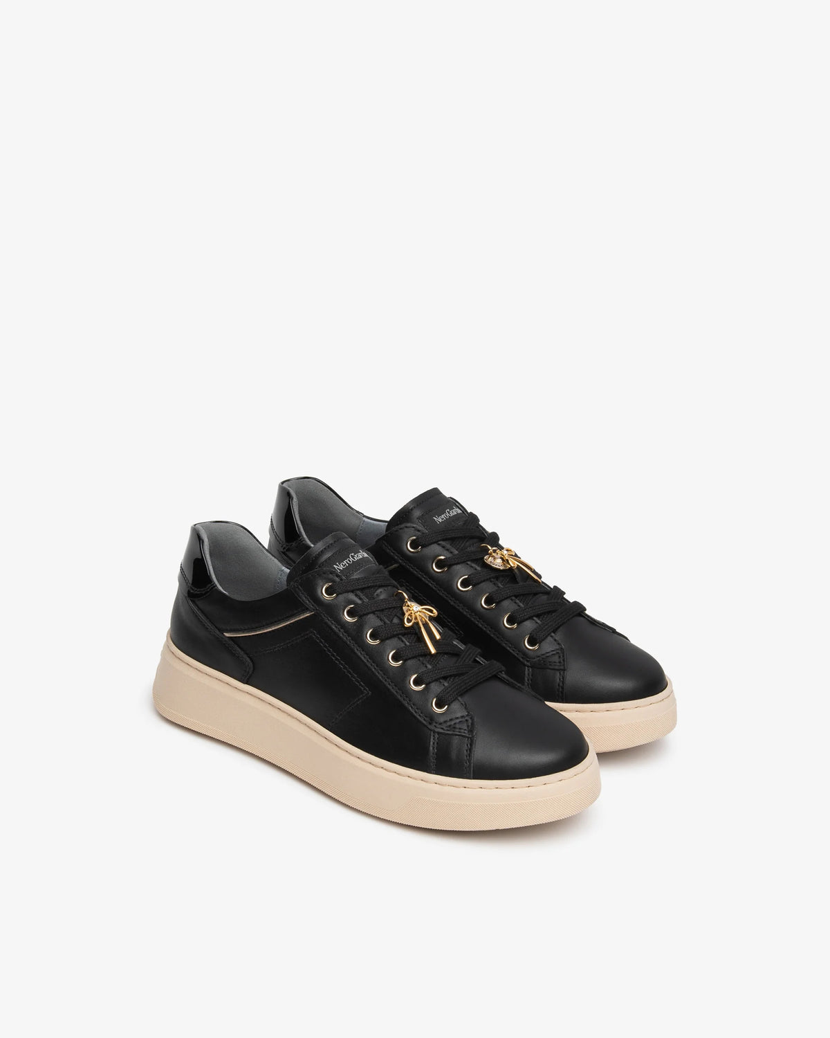 Sneakers in pelle , vernice e materiale tecnico